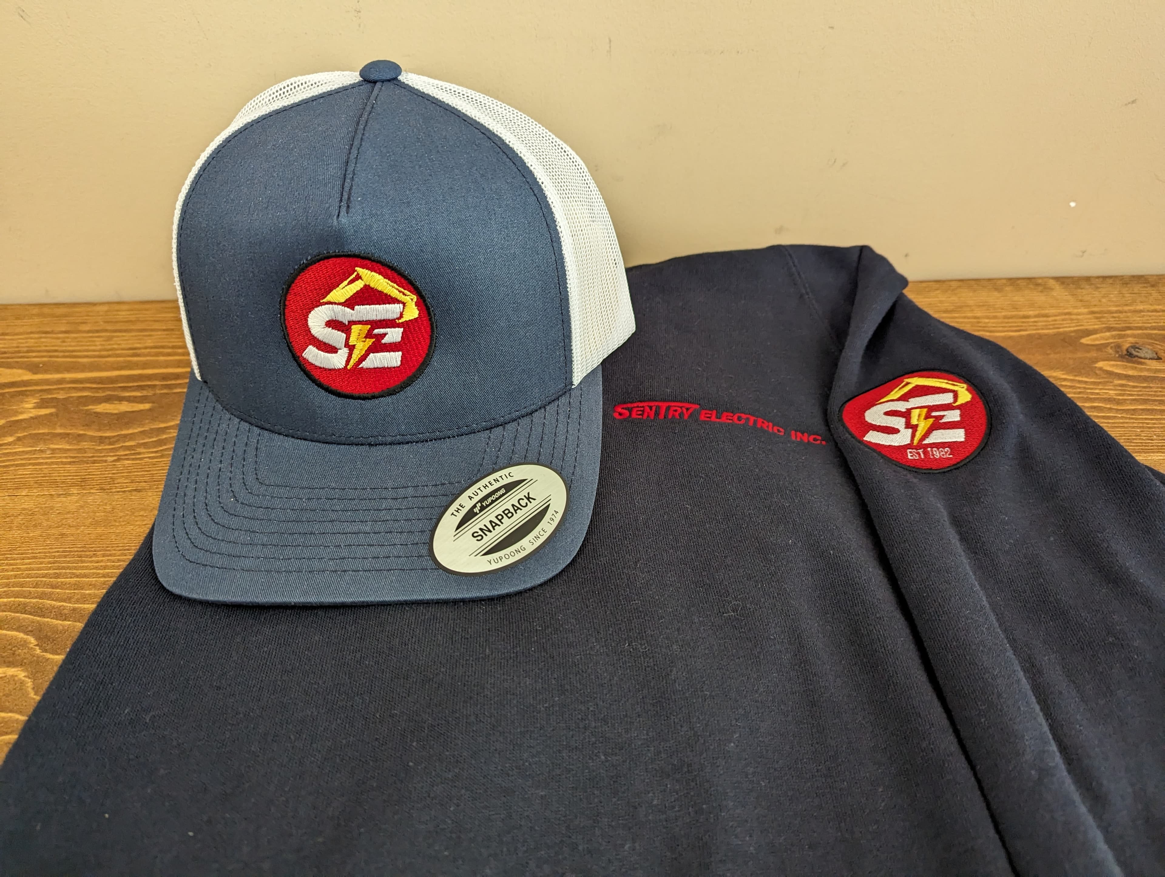 Embroidered cap patch and hoodie sewn out